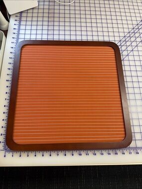 Memo Board orange horizontal string in a dark wood frame 17” square